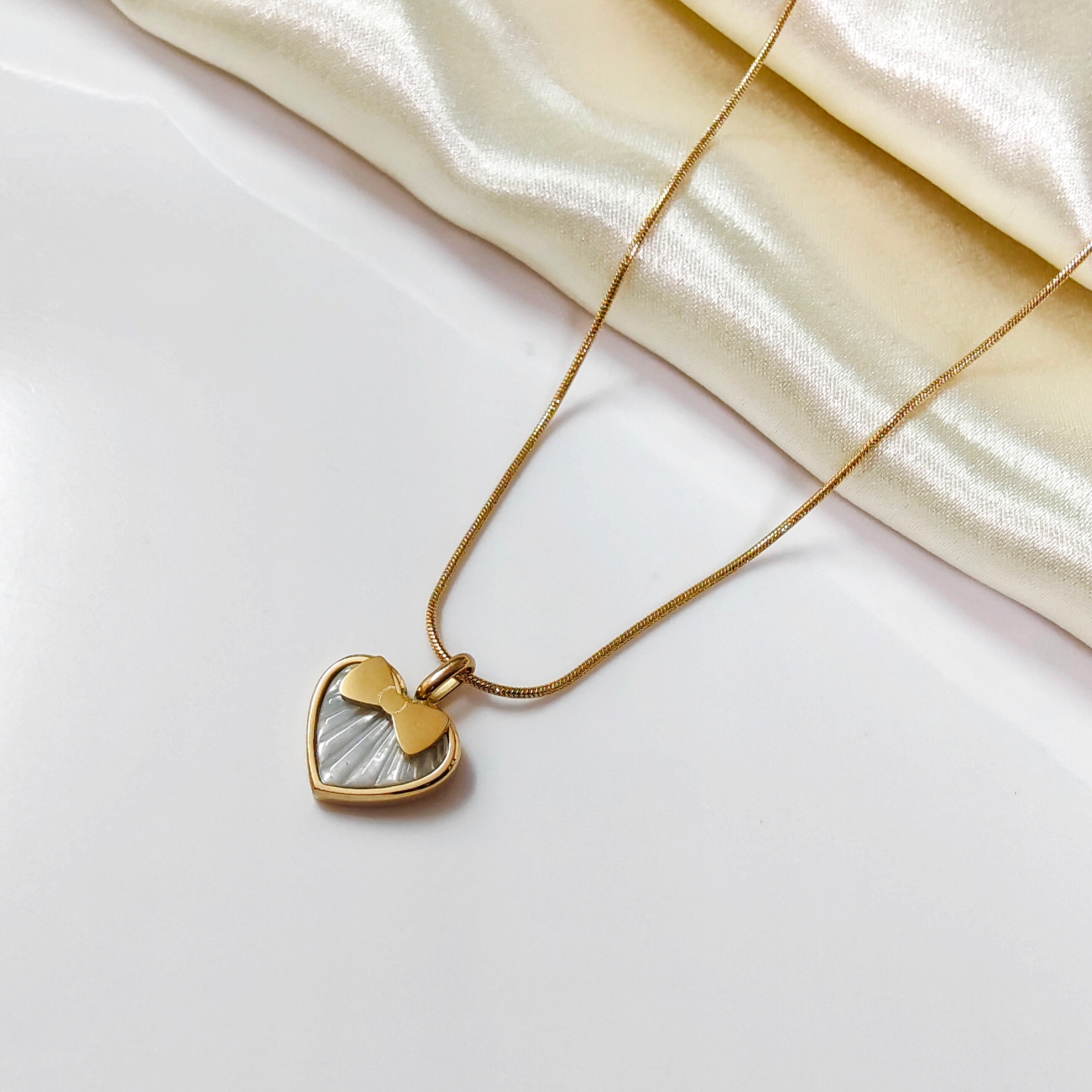 Heart in a bow necklace