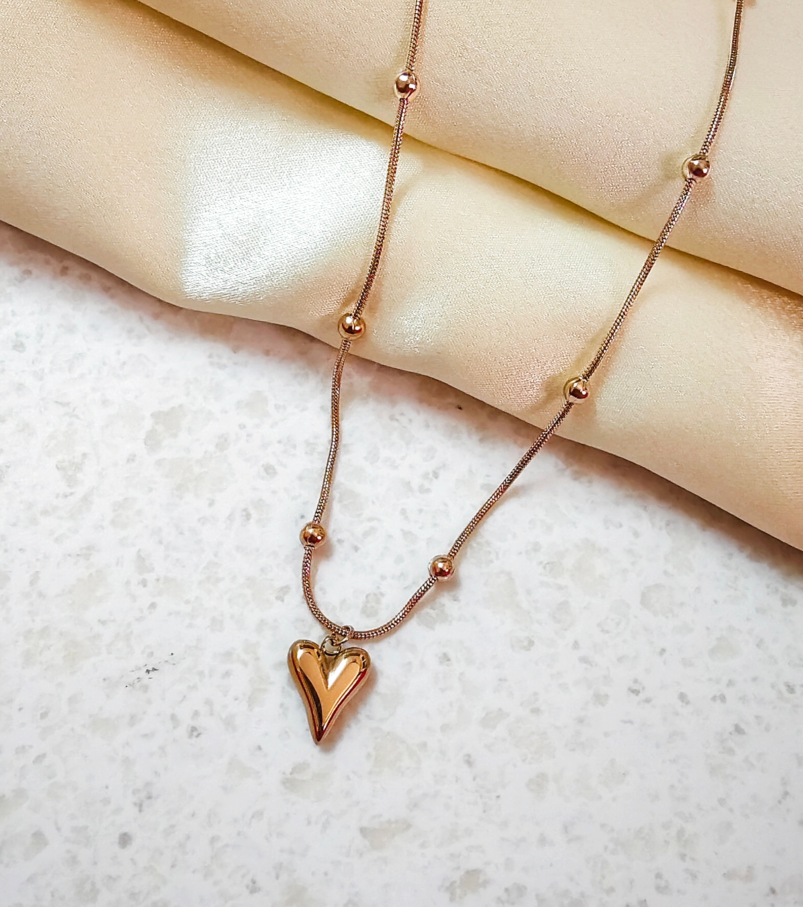 Elongated puffy heart necklace