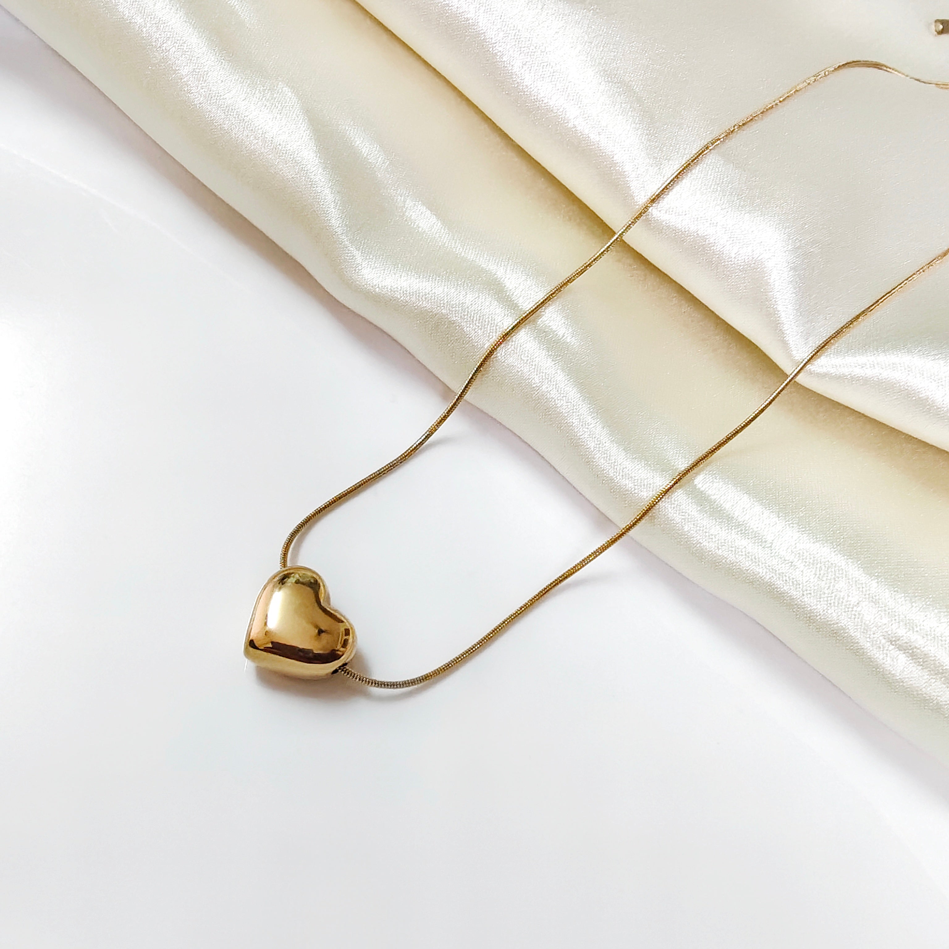 Gold guild heart necklace