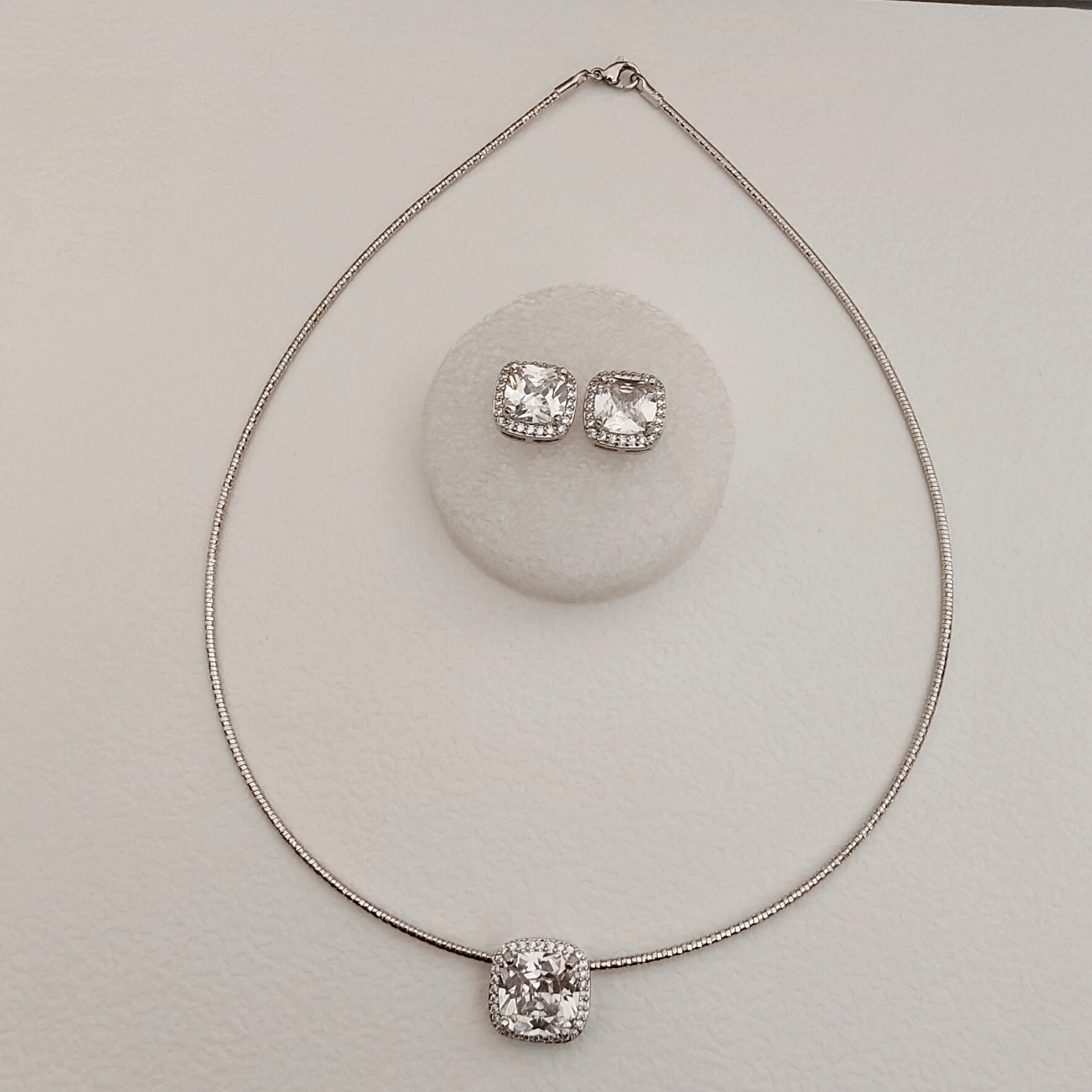 Solitaire stiff silver set pendant set