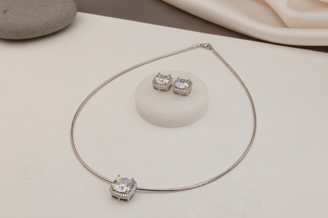 Solitaire stiff silver set pendant set