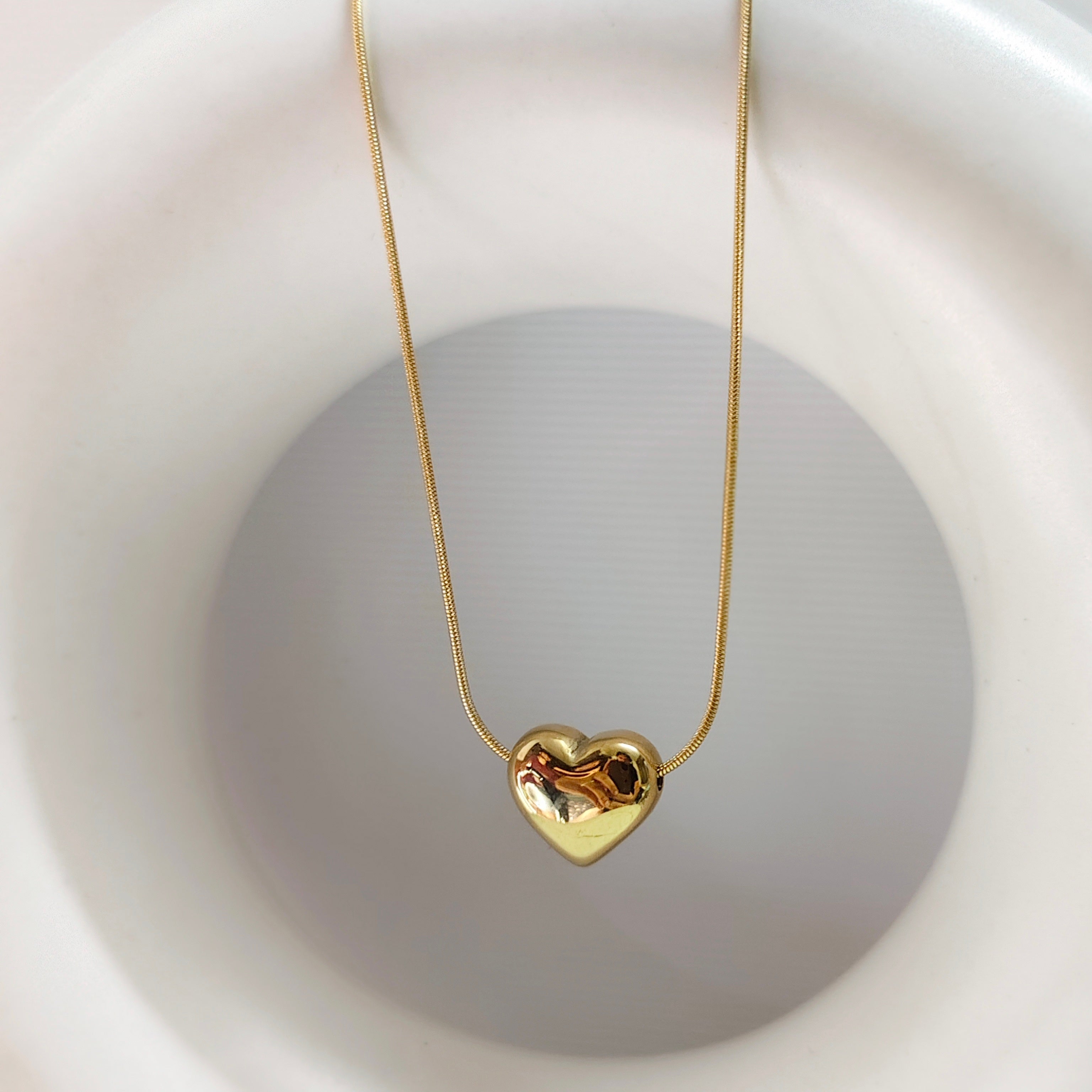 Gold guild heart necklace